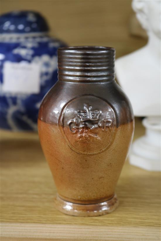 A GI stoneware jug, a Doulton jug and two others 8cm - 22cm